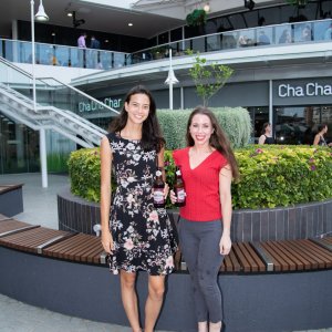 Two people smiling at event
