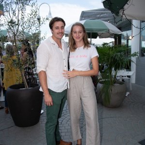 Two people smiling at event